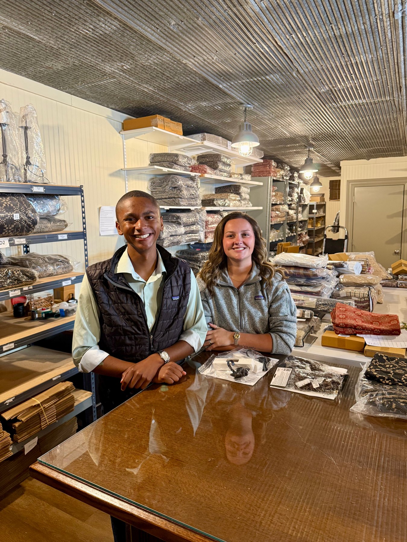Peyton Heckaman and Zoey Hollar working together at the warehouse